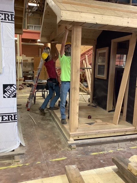 carpentry students building porch roof