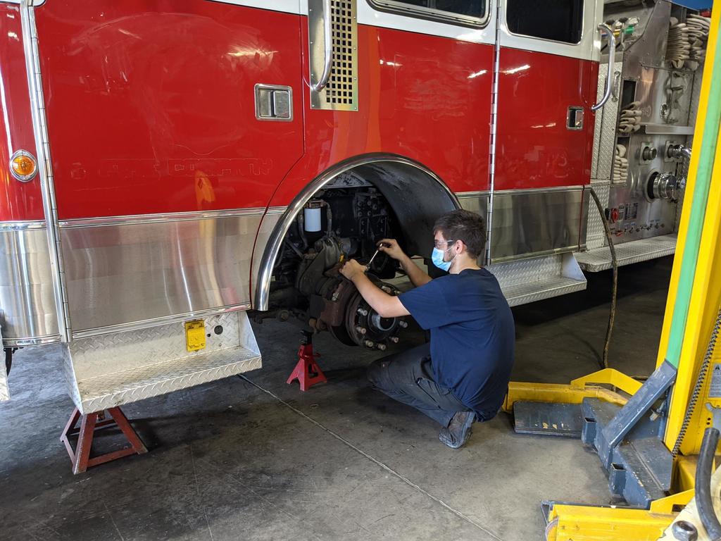 diesel student works on firetruck maintenance