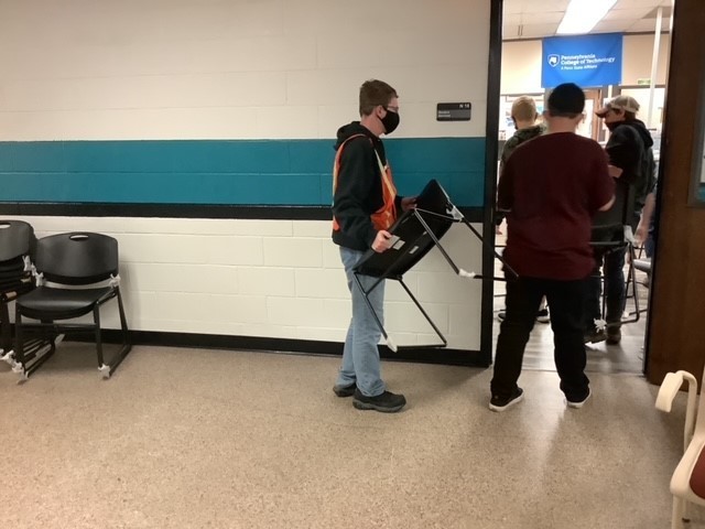 logistics students delivering items