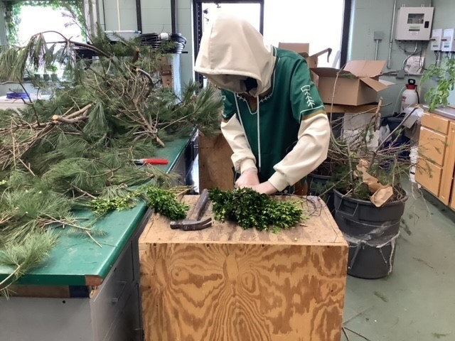 horticulture student making wreaths